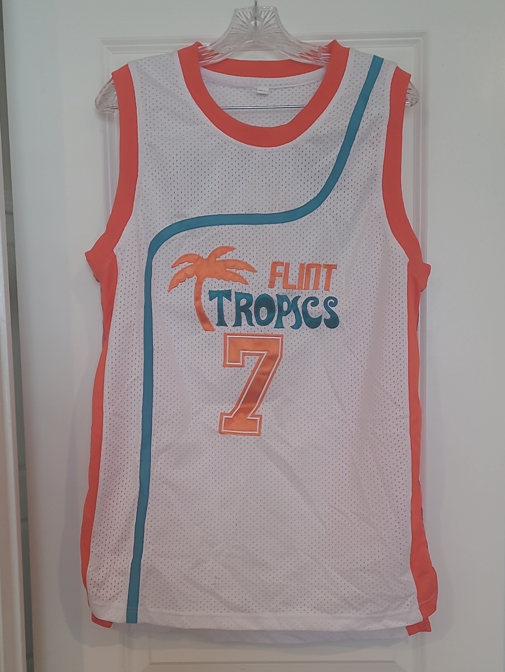 Flint Tropics Sleeveless Basketball Jersey - White with Orange & Teal.